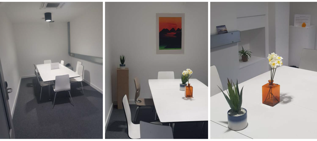 There are 3 photos presented side by side. The first has an empty classroom/office space, while the second has added flowers to the table, a plant pot, and a painting. The third image focuses on the flowers on the table and a plant pot that fits into an alcove in the wall. 